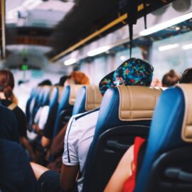 selective focus photography of people on bus