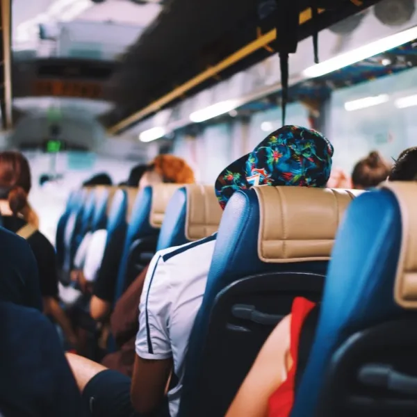 selective focus photography of people on bus